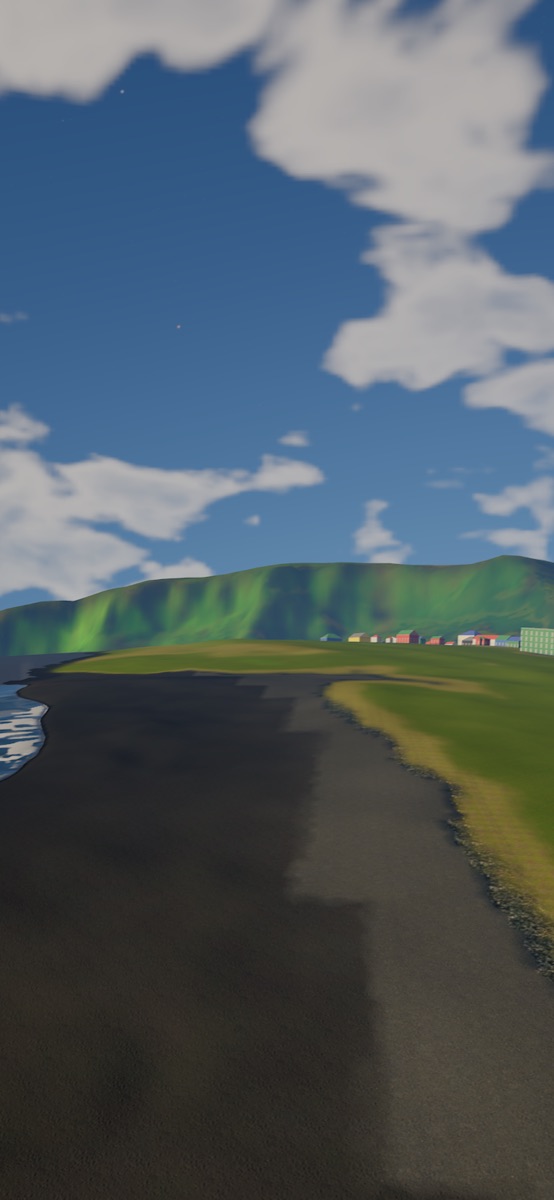 The black sand beach at Vík, Iceland, with the village and green cliffs behind it.