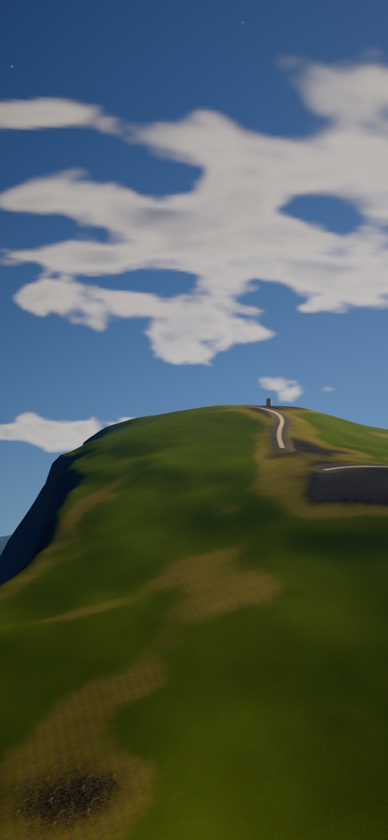 The grassy top of Reynisfjall mountain in Iceland, with a road and a blue sky.